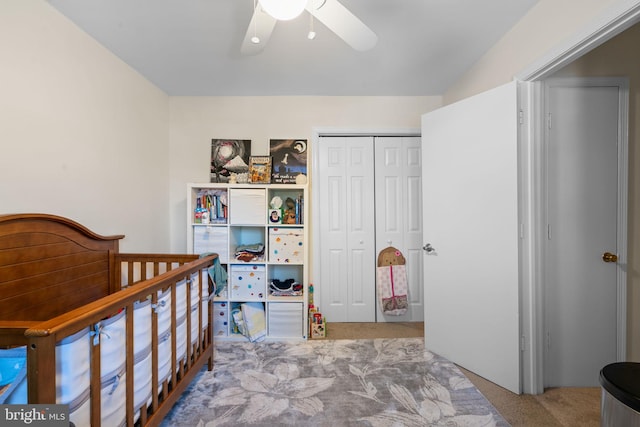 bedroom with a closet, ceiling fan, and carpet flooring