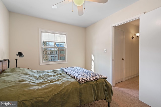 bedroom featuring light carpet and ceiling fan