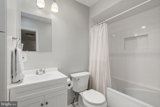 full bathroom featuring vanity, shower / tub combo, and toilet