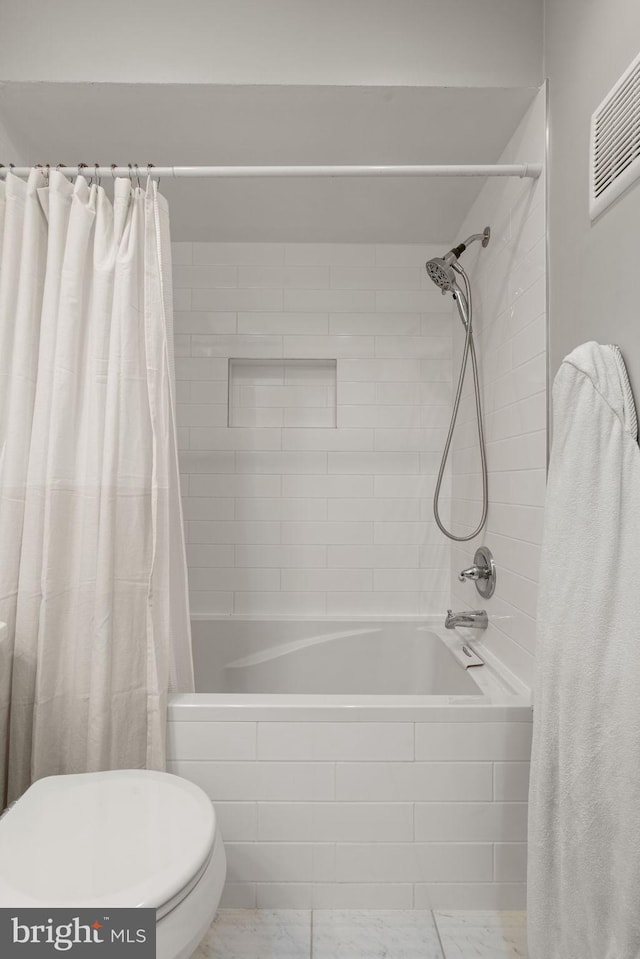 bathroom with shower / tub combo