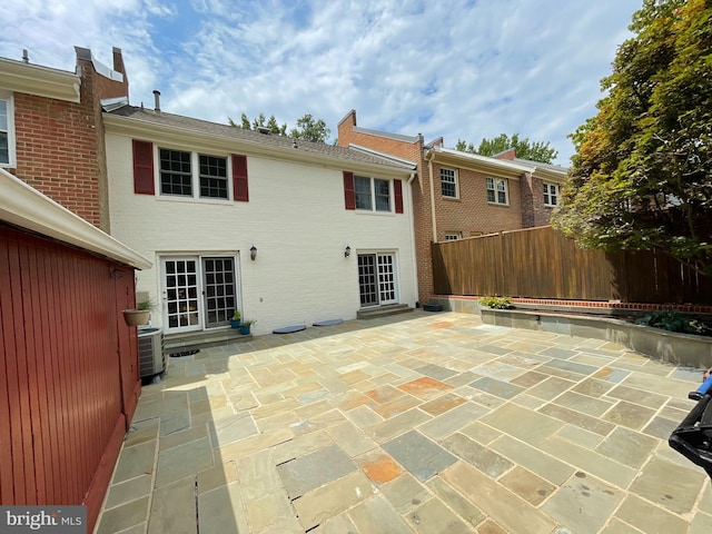 back of property featuring a patio area and central air condition unit