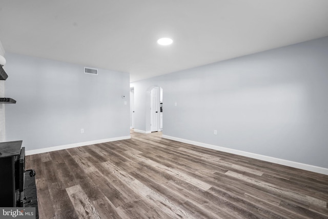 unfurnished living room featuring hardwood / wood-style flooring