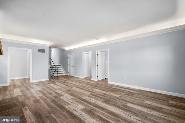 unfurnished room featuring crown molding and wood-type flooring