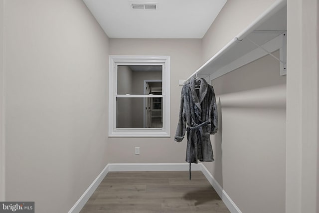 spacious closet featuring hardwood / wood-style flooring