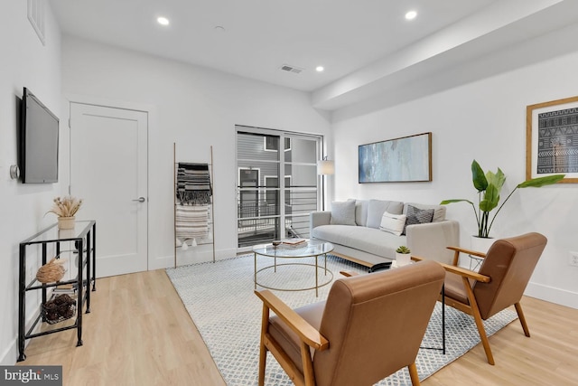 living room with light hardwood / wood-style flooring