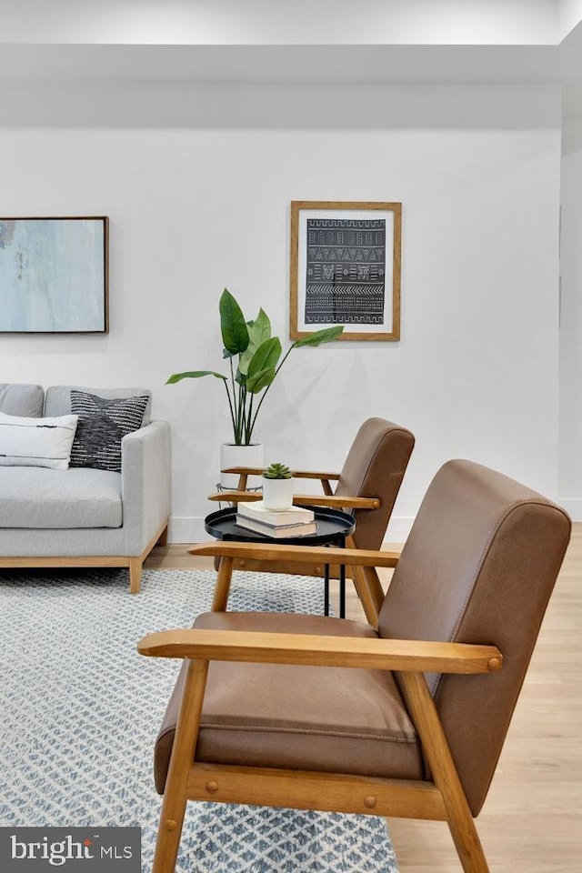 living area with wood-type flooring