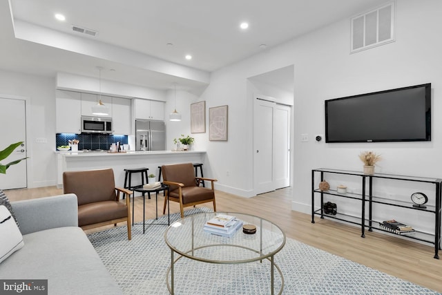 living room featuring light wood-type flooring