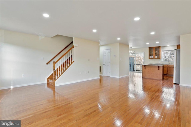 unfurnished living room with light wood-type flooring