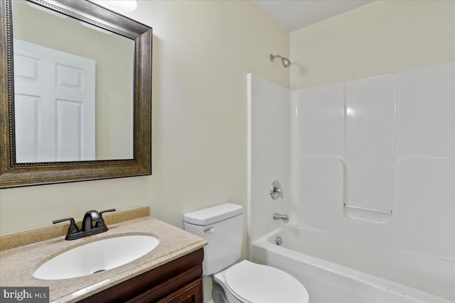 full bathroom featuring bathing tub / shower combination, vanity, and toilet