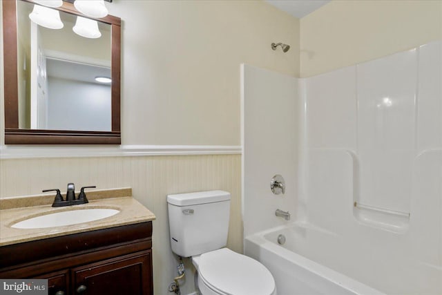 full bathroom with vanity, toilet, and shower / washtub combination