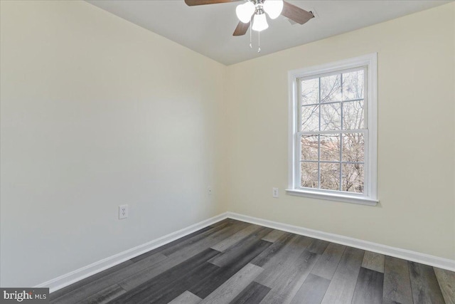 unfurnished room with ceiling fan and dark hardwood / wood-style floors