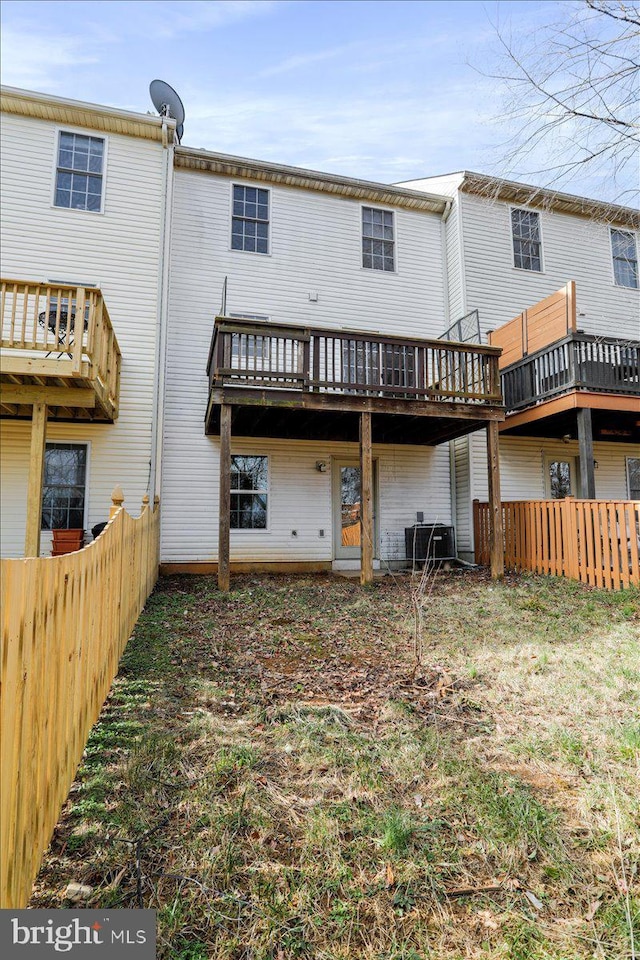 back of property featuring cooling unit