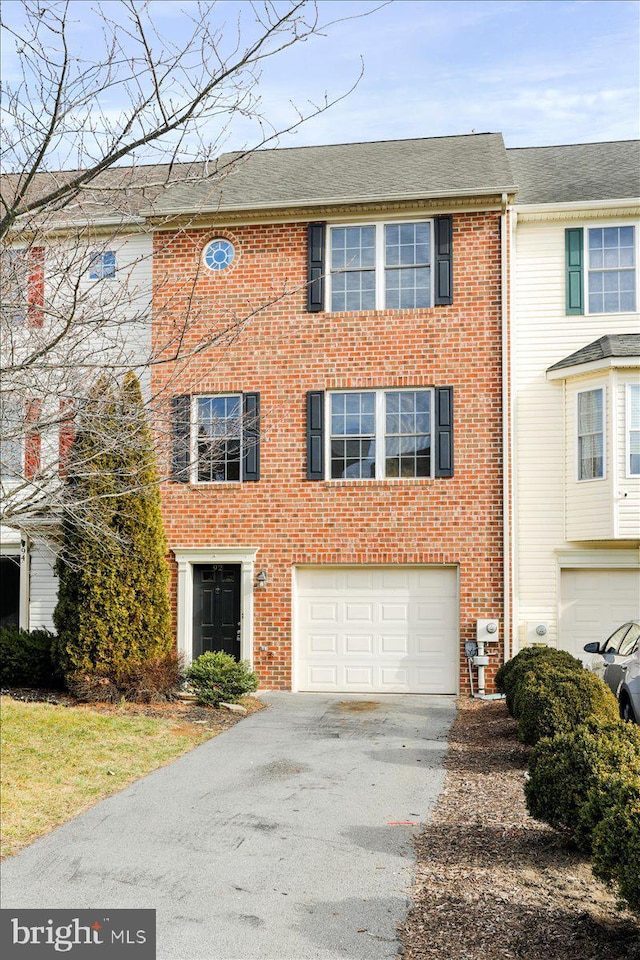 multi unit property featuring a garage