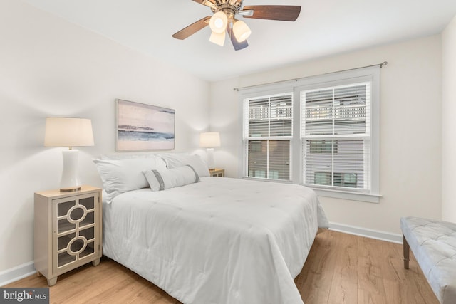 bedroom with ceiling fan and light hardwood / wood-style floors