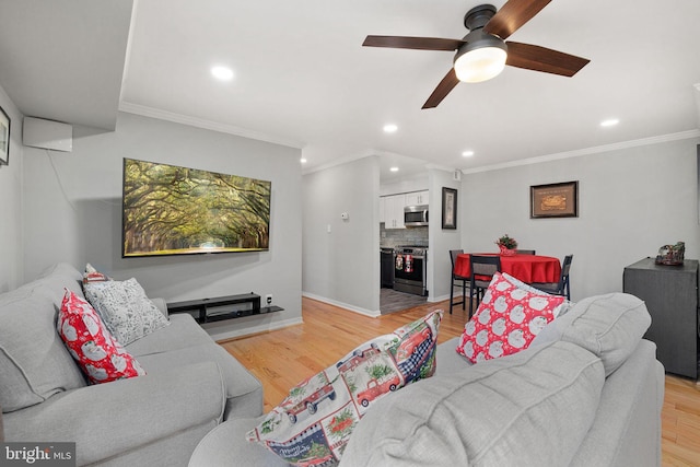 living room featuring crown molding, light hardwood / wood-style flooring, and ceiling fan