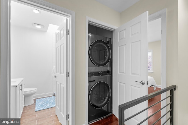 clothes washing area with stacked washer / drying machine