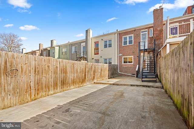 back of property featuring a patio