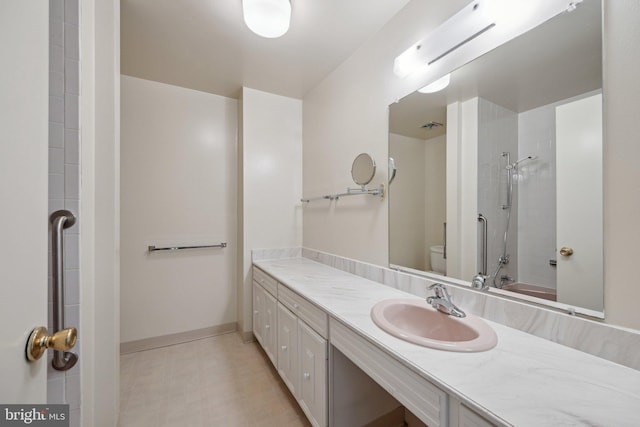 full bathroom featuring bathing tub / shower combination, vanity, toilet, and baseboards