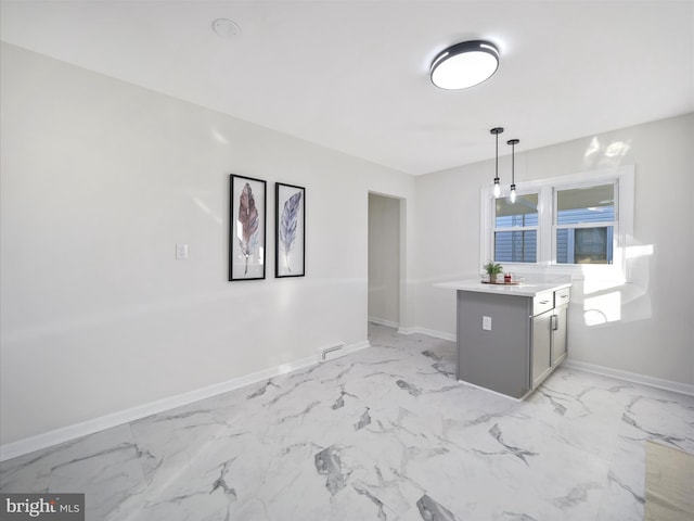 interior space featuring pendant lighting and kitchen peninsula