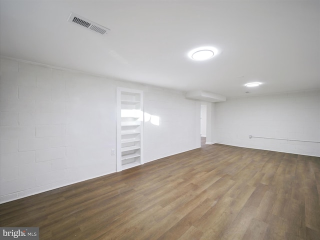 basement with hardwood / wood-style flooring