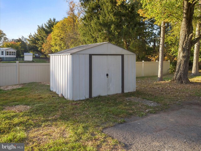 view of outdoor structure with a lawn