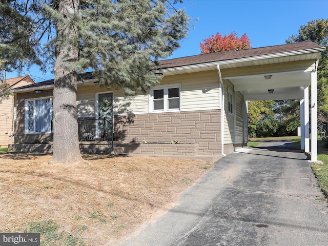 view of front of home featuring a carport