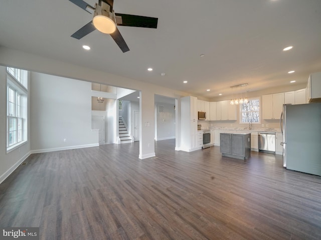 12544 Woodsboro Pike, Keymar, MD 21757 - unfurnished living room featuring ceiling fan, dark hardwood / wood-style flooring, and sink