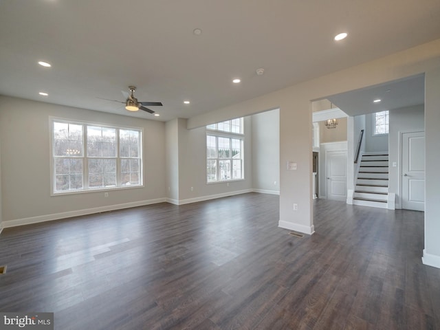 12544 Woodsboro Pike, Keymar, MD 21757 - unfurnished living room featuring ceiling fan with notable chandelier, dark hardwood / wood-style floors, and a healthy amount of sunlight