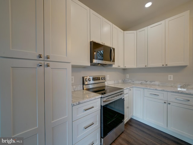 12544 Woodsboro Pike, Keymar, MD 21757 - kitchen featuring white cabinetry, light stone countertops, dark hardwood / wood-style floors, and appliances with stainless steel finishes