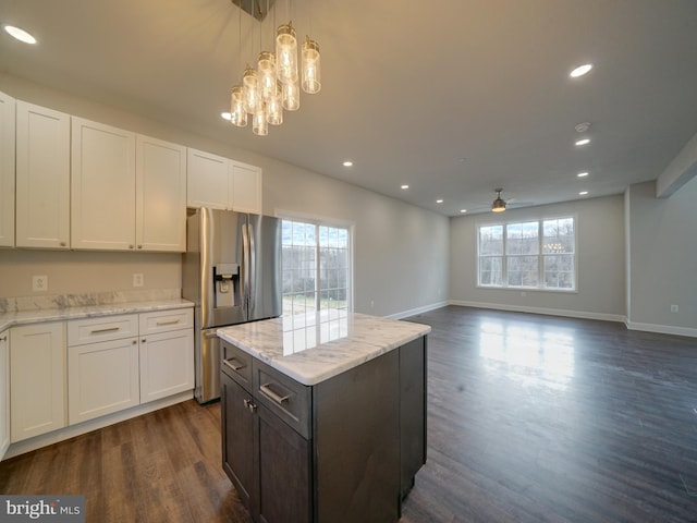 12544 Woodsboro Pike, Keymar, MD 21757 - kitchen with dark hardwood / wood-style floors, stainless steel fridge, pendant lighting, white cabinets, and ceiling fan with notable chandelier