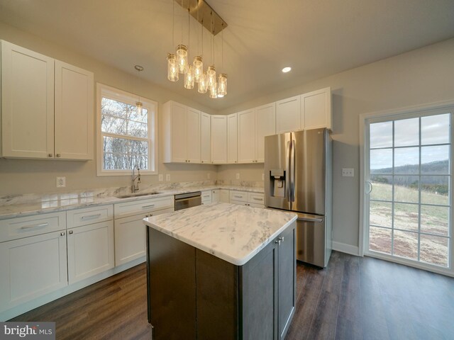 12544 Woodsboro Pike, Keymar, MD 21757 - kitchen with a center island, sink, appliances with stainless steel finishes, decorative light fixtures, and white cabinetry