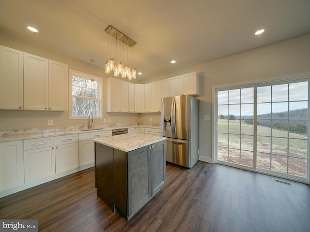 12544 Woodsboro Pike, Keymar, MD 21757 - kitchen with a center island, sink, stainless steel appliances, pendant lighting, and white cabinets