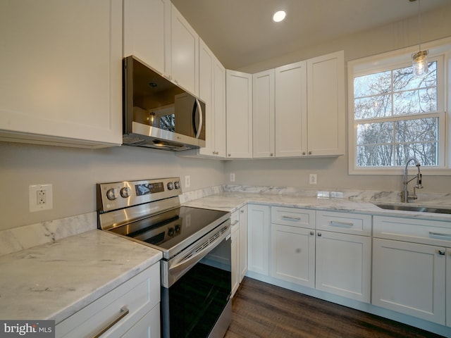 12544 Woodsboro Pike, Keymar, MD 21757 - kitchen featuring light stone countertops, appliances with stainless steel finishes, white cabinetry, and sink