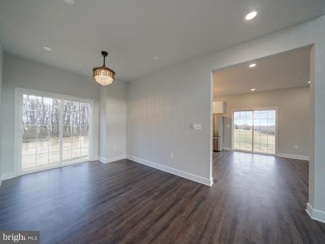12544 Woodsboro Pike, Keymar, MD 21757 - unfurnished room with dark hardwood / wood-style flooring and a notable chandelier