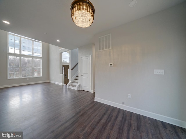 12544 Woodsboro Pike, Keymar, MD 21757 - unfurnished living room featuring dark hardwood / wood-style flooring and a chandelier