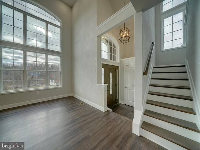 12544 Woodsboro Pike, Keymar, MD 21757 - entrance foyer with a chandelier, a towering ceiling, and dark wood-type flooring