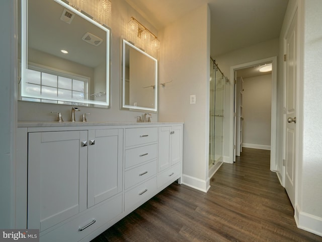 12544 Woodsboro Pike, Keymar, MD 21757 - bathroom featuring hardwood / wood-style floors, vanity, and a shower with shower door