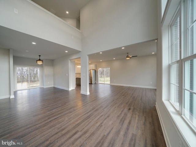 12544 Woodsboro Pike, Keymar, MD 21757 - unfurnished room with ceiling fan, a healthy amount of sunlight, dark hardwood / wood-style flooring, and a high ceiling