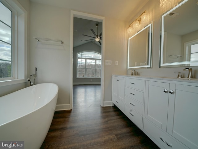 12544 Woodsboro Pike, Keymar, MD 21757 - bathroom with vanity, lofted ceiling, a bath, hardwood / wood-style flooring, and ceiling fan