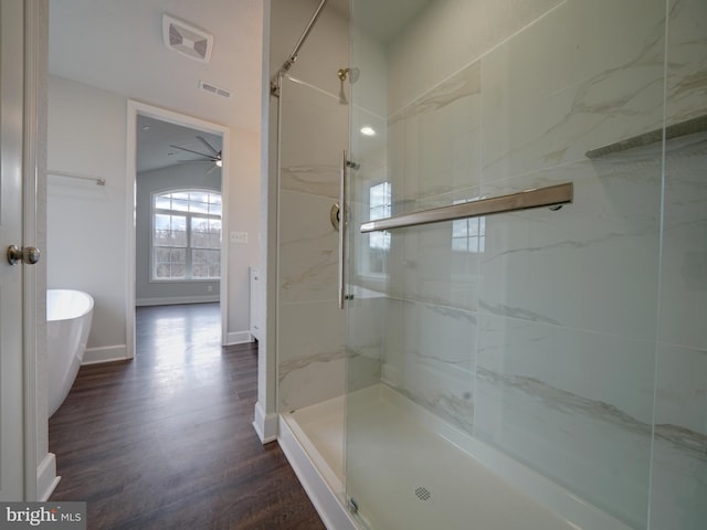 12544 Woodsboro Pike, Keymar, MD 21757 - bathroom featuring ceiling fan, a shower with door, and hardwood / wood-style flooring