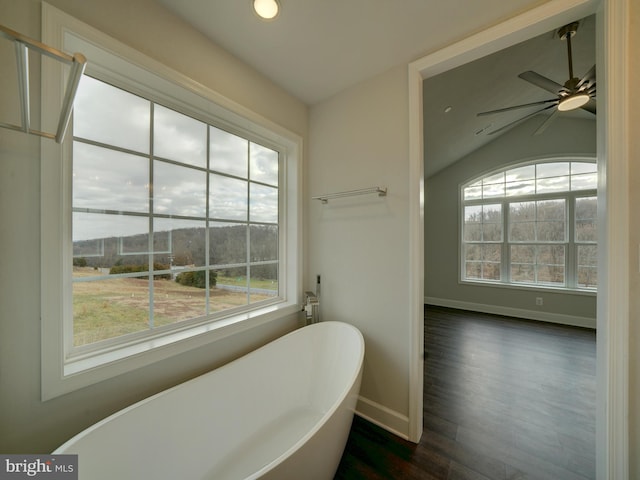 12544 Woodsboro Pike, Keymar, MD 21757 - bathroom with ceiling fan, a bath, lofted ceiling, and hardwood / wood-style flooring