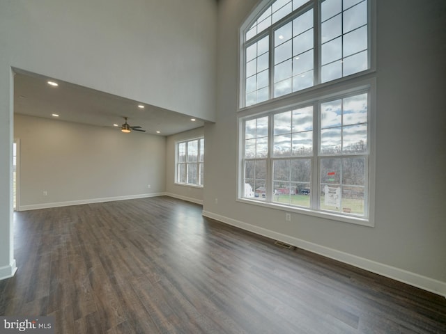 12544 Woodsboro Pike, Keymar, MD 21757 - unfurnished living room featuring ceiling fan, dark hardwood / wood-style floors, and a towering ceiling