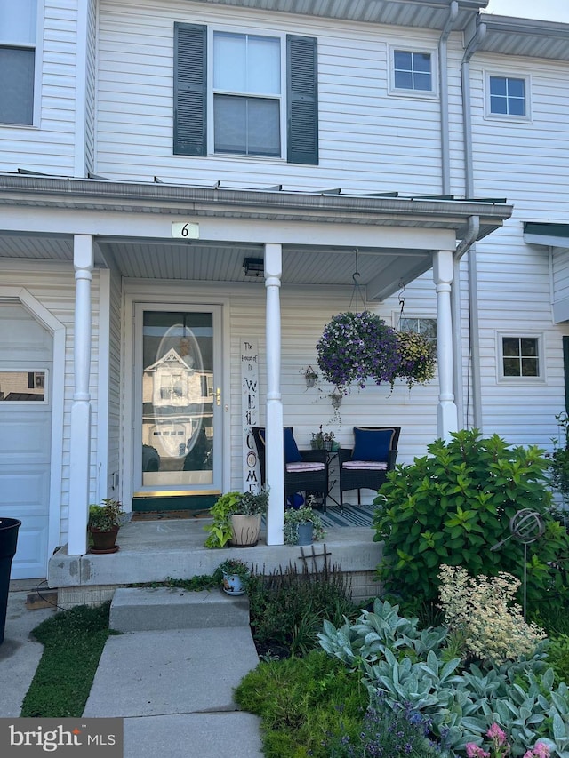 doorway to property featuring a porch