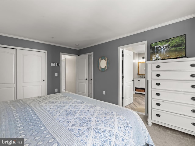 bedroom featuring light parquet floors, a closet, and crown molding