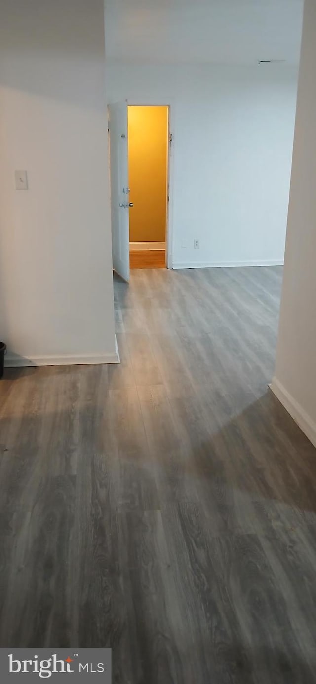 unfurnished room with hardwood / wood-style flooring