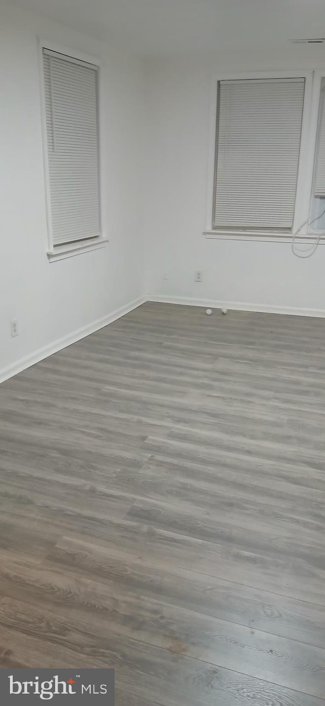 spare room featuring hardwood / wood-style floors