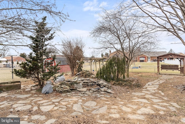 view of yard with fence and a gazebo