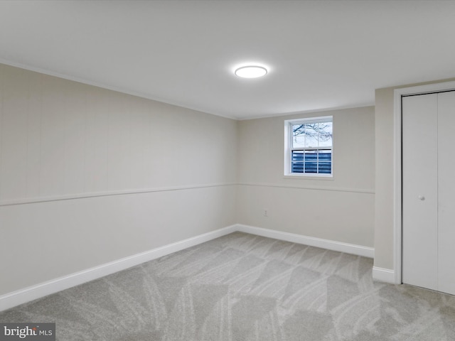 unfurnished bedroom featuring light carpet