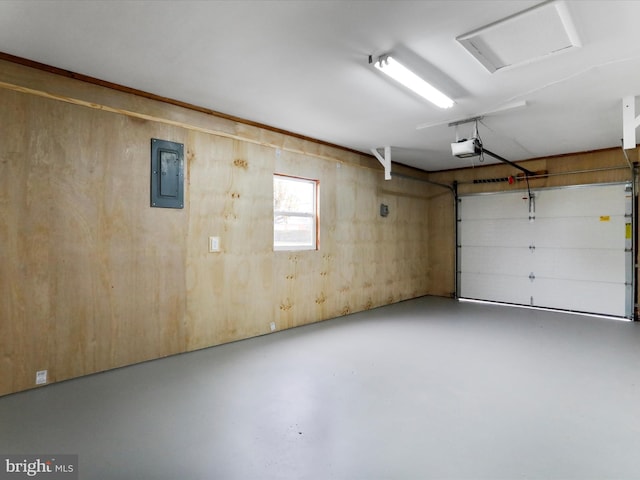 garage with electric panel and a garage door opener