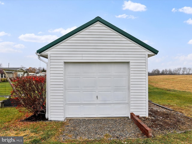 garage with a lawn